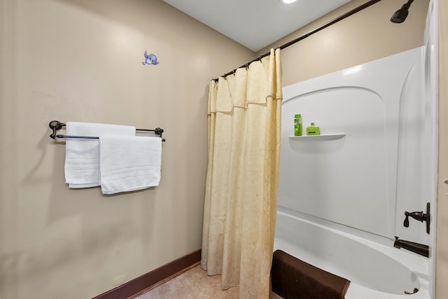 bathroom with shower / bathtub combination with curtain