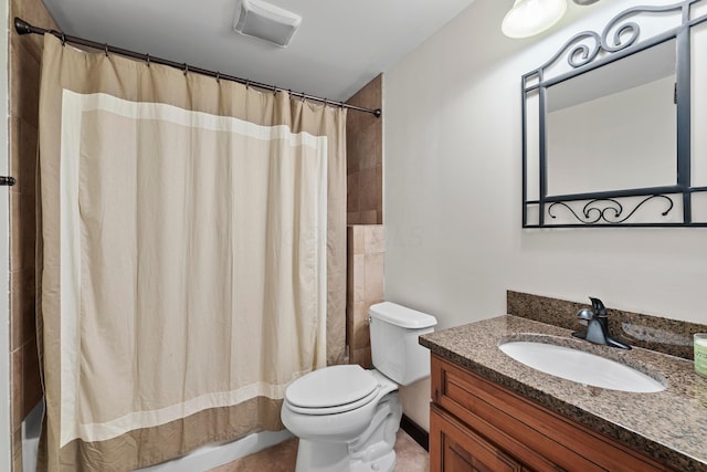 bathroom featuring vanity, toilet, and curtained shower