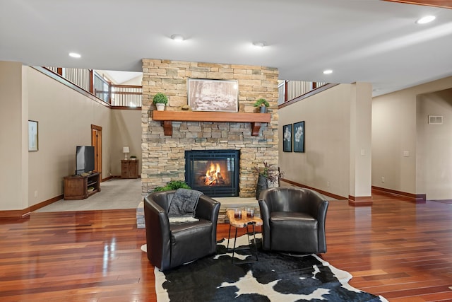 living room featuring a fireplace and wood-type flooring