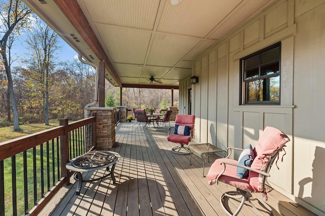 wooden terrace featuring ceiling fan