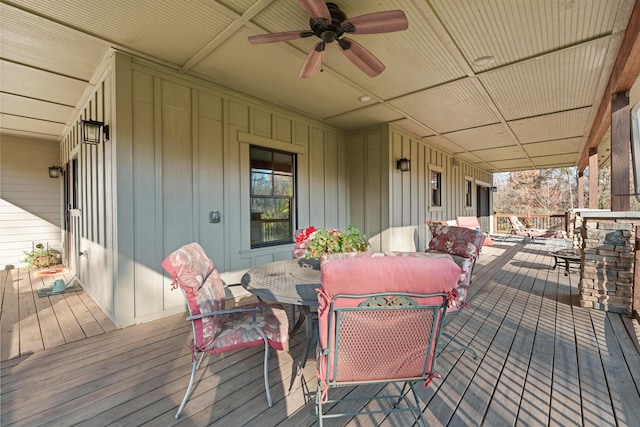 wooden deck featuring ceiling fan and covered porch