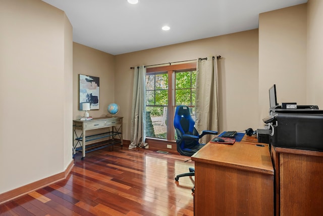 office with dark hardwood / wood-style flooring