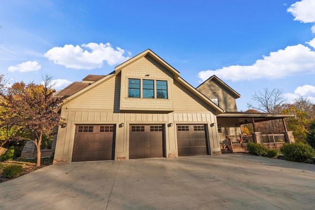 craftsman-style home featuring covered porch and a garage