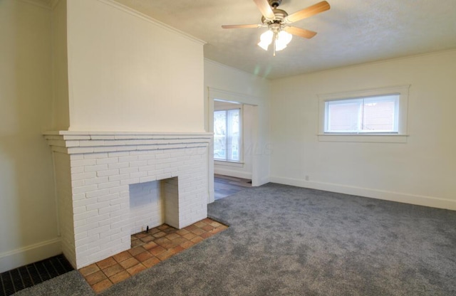 unfurnished living room featuring a healthy amount of sunlight, carpet floors, and crown molding