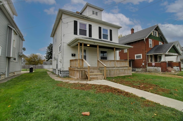 view of front of property featuring a porch and a front yard