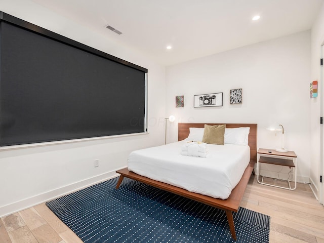 bedroom with light hardwood / wood-style flooring