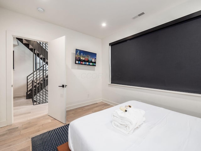 bedroom featuring light hardwood / wood-style floors