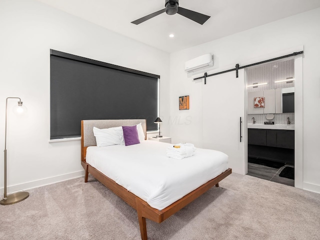 bedroom featuring carpet, ceiling fan, a barn door, and a wall mounted AC