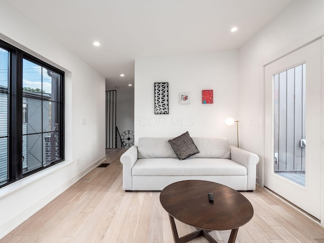 living room with light hardwood / wood-style floors