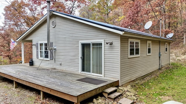 back of property featuring a wooden deck