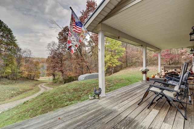 wooden deck with a yard