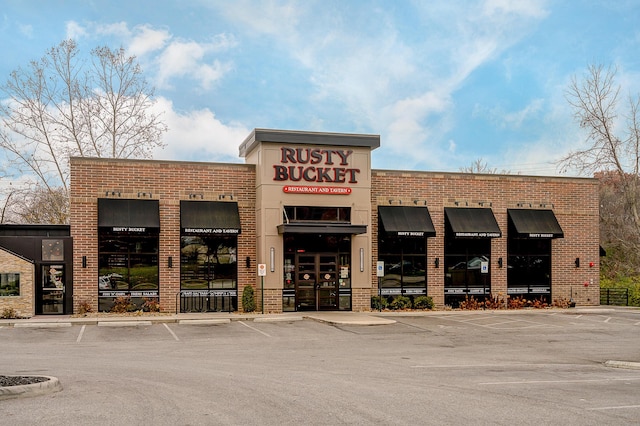 view of property featuring uncovered parking