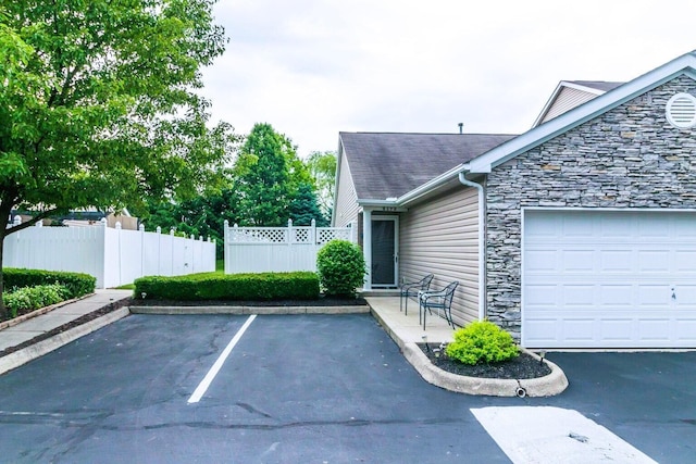 view of property exterior featuring a garage