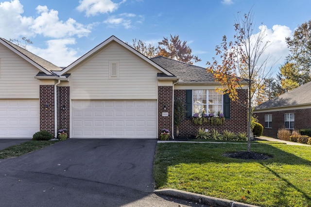 ranch-style house with a garage and a front yard