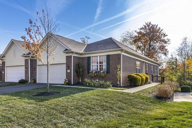 single story home featuring a front yard and a garage