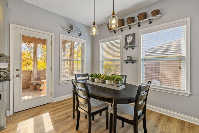 dining area with a healthy amount of sunlight and light wood-type flooring