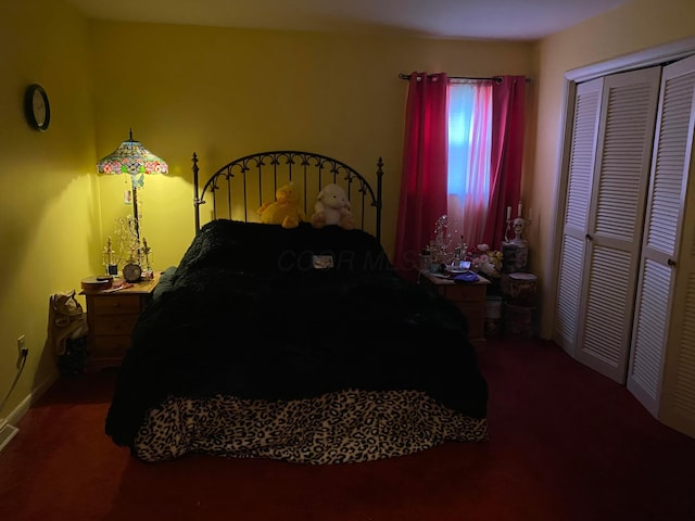 carpeted bedroom featuring a closet