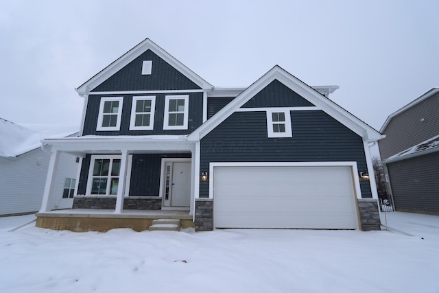 view of front facade featuring a porch and a garage