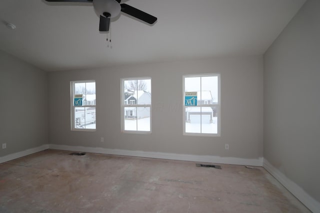 unfurnished room featuring ceiling fan and a healthy amount of sunlight