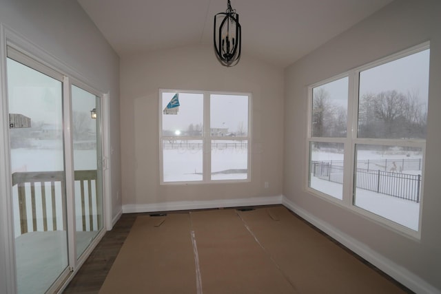 unfurnished sunroom featuring lofted ceiling