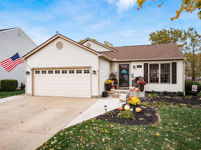 view of front facade featuring a front lawn and a garage