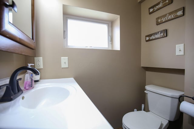 bathroom with toilet and sink