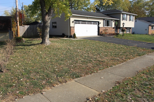 view of front of home featuring a garage and a front yard