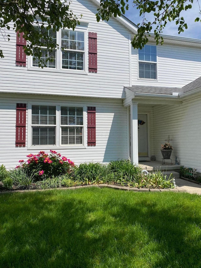 332 Masonglen Ct, Pataskala, OH 43062 - view of exterior entry featuring a yard