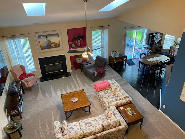 332 Masonglen Ct, Pataskala, OH 43062 - tiled living area with a skylight, a fireplace with flush hearth, baseboards, and carpet floors