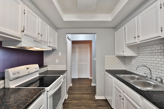 kitchen featuring a textured ceiling, white appliances, dark wood-type flooring, sink, and white cabinetry