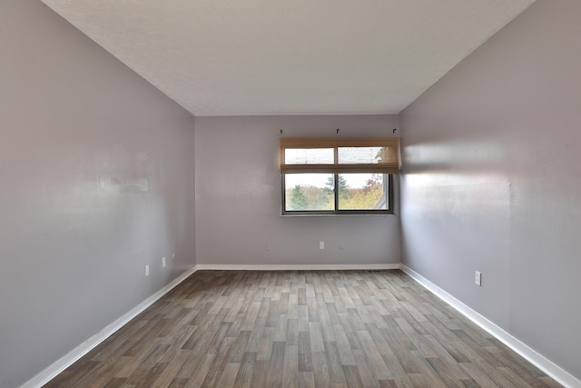 unfurnished room with light hardwood / wood-style floors