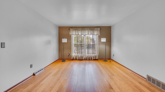 empty room featuring hardwood / wood-style flooring