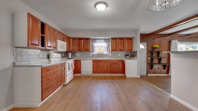 kitchen featuring beam ceiling, decorative backsplash, light hardwood / wood-style flooring, and white appliances