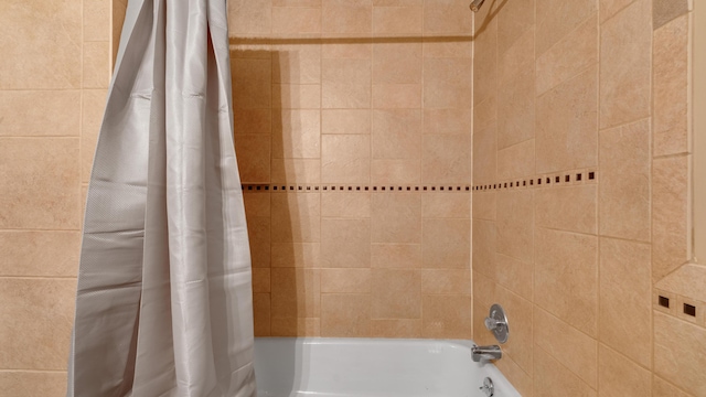 bathroom featuring shower / bath combination with curtain