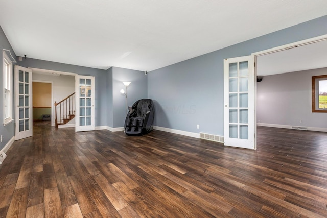 interior space featuring dark wood-type flooring and french doors