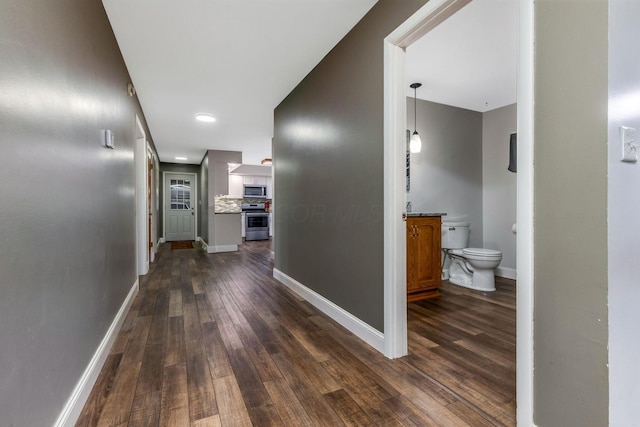 hall with dark hardwood / wood-style floors