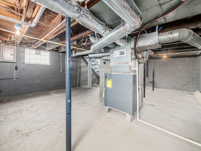 basement featuring heating unit