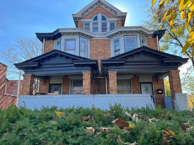 1423 E Main St, Columbus, OH 43205 - view of front facade featuring a porch and brick siding