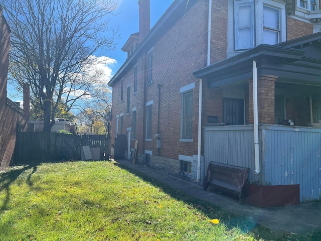 1423 E Main St, Columbus, OH 43205 - view of home's exterior with brick siding and a chimney