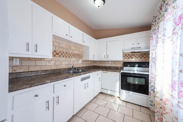 kitchen with sink, vaulted ceiling, white appliances, decorative backsplash, and white cabinets