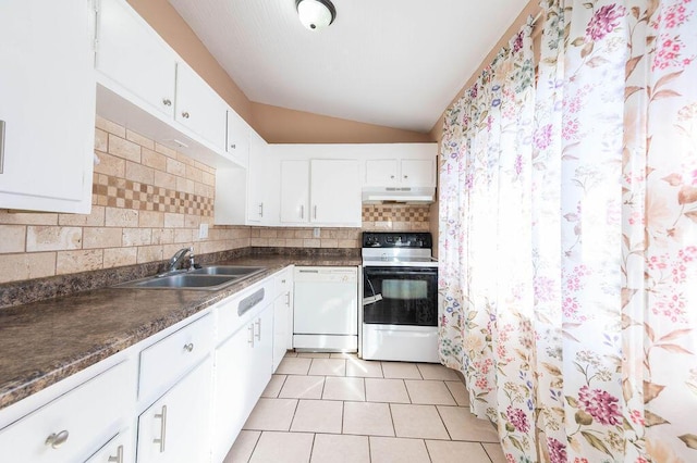 kitchen featuring tasteful backsplash, white appliances, sink, white cabinets, and lofted ceiling