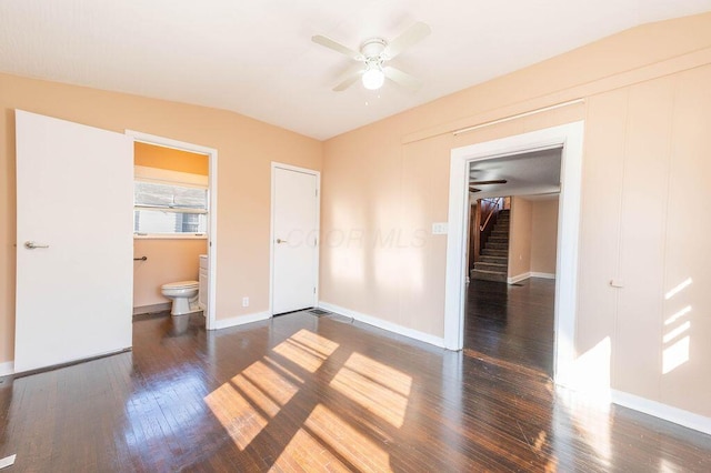 unfurnished bedroom with ensuite bathroom, ceiling fan, dark hardwood / wood-style floors, a closet, and lofted ceiling