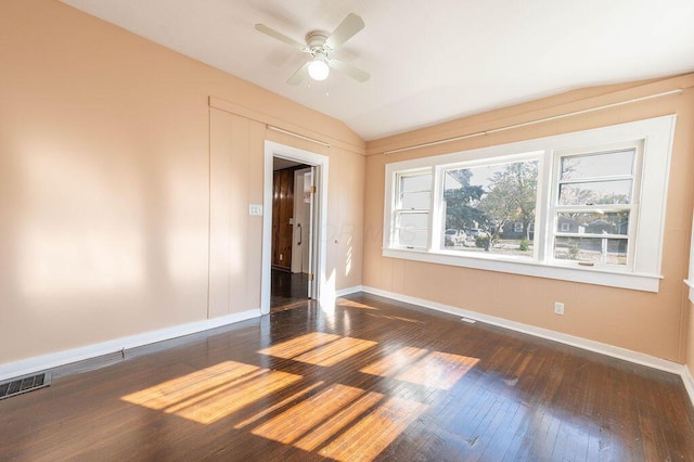 spare room with ceiling fan, dark hardwood / wood-style floors, and lofted ceiling