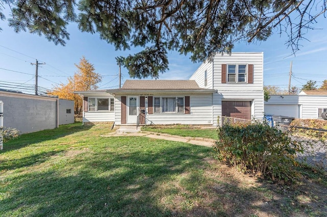 view of front of house featuring a front lawn and a garage