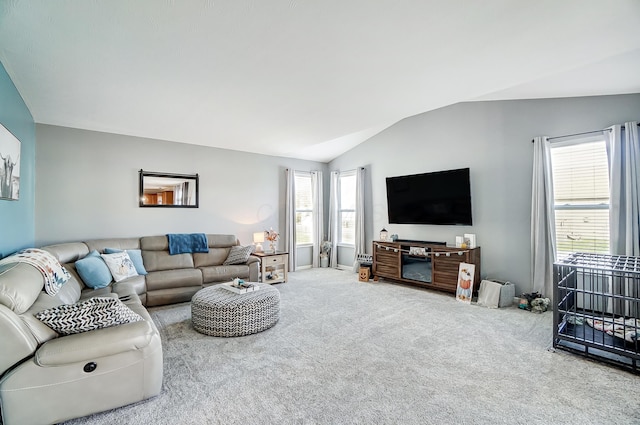 living room featuring plenty of natural light, carpet floors, and lofted ceiling