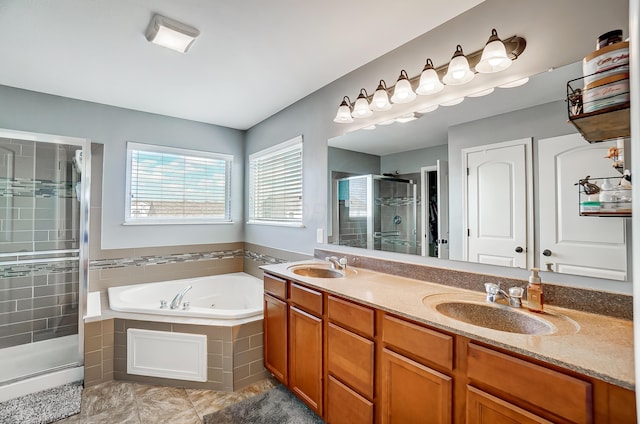 bathroom with plus walk in shower, vanity, and tile patterned flooring