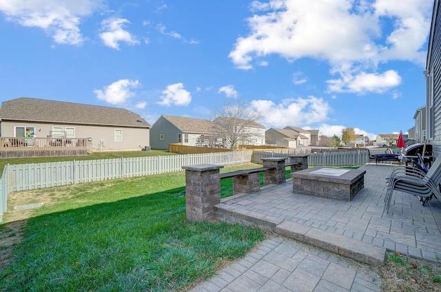 view of yard with a fire pit and a patio area