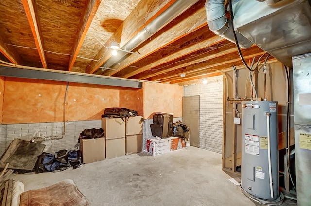 basement with brick wall and water heater