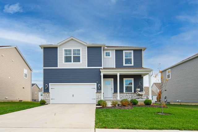 craftsman-style home with covered porch, a garage, and a front yard