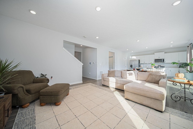 living room with light hardwood / wood-style flooring